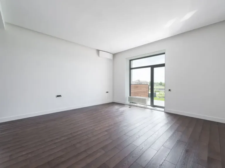 A bright, empty room after everything has been cleared out