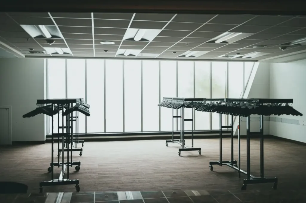 An empty commercial unit with metal racking left in place