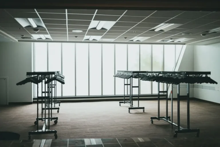 An empty commercial unit with metal racking left in place