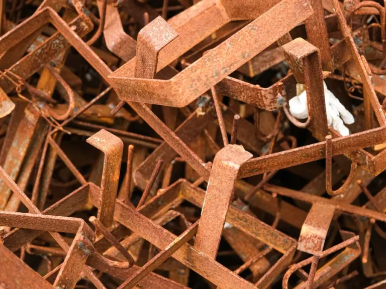 A close-up of rusted metal offcuts stacked together